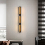 Modern wall light decoration mounted beside a bed, adding a contemporary touch to the room.