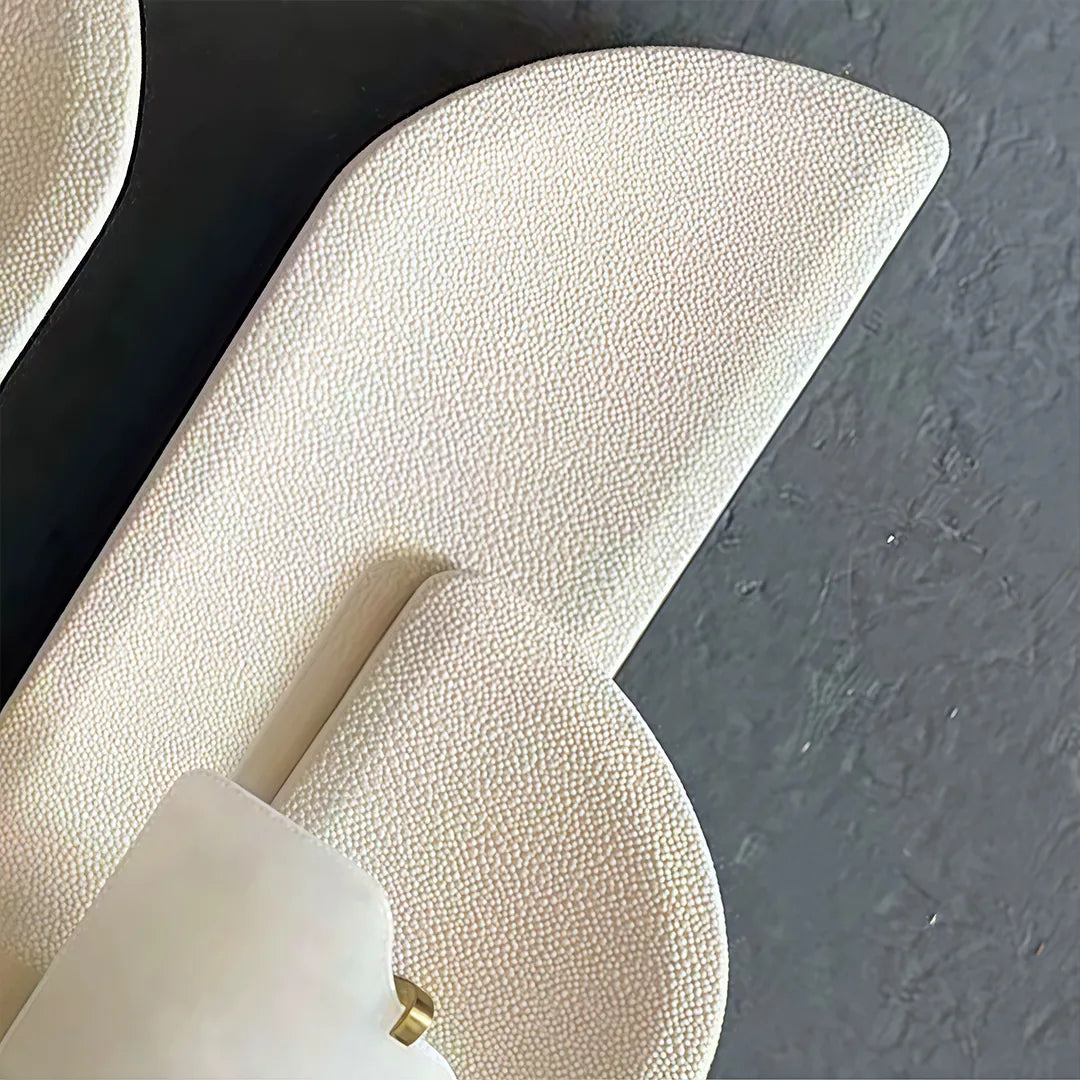 Modern wall light fixtures detail showing the textured curved panel and layered illuminated design.
