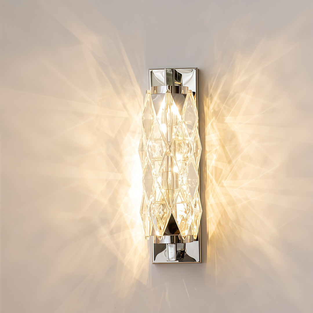 Modern wall light mounted on textured gold wall creating dramatic lighting effect at evening.