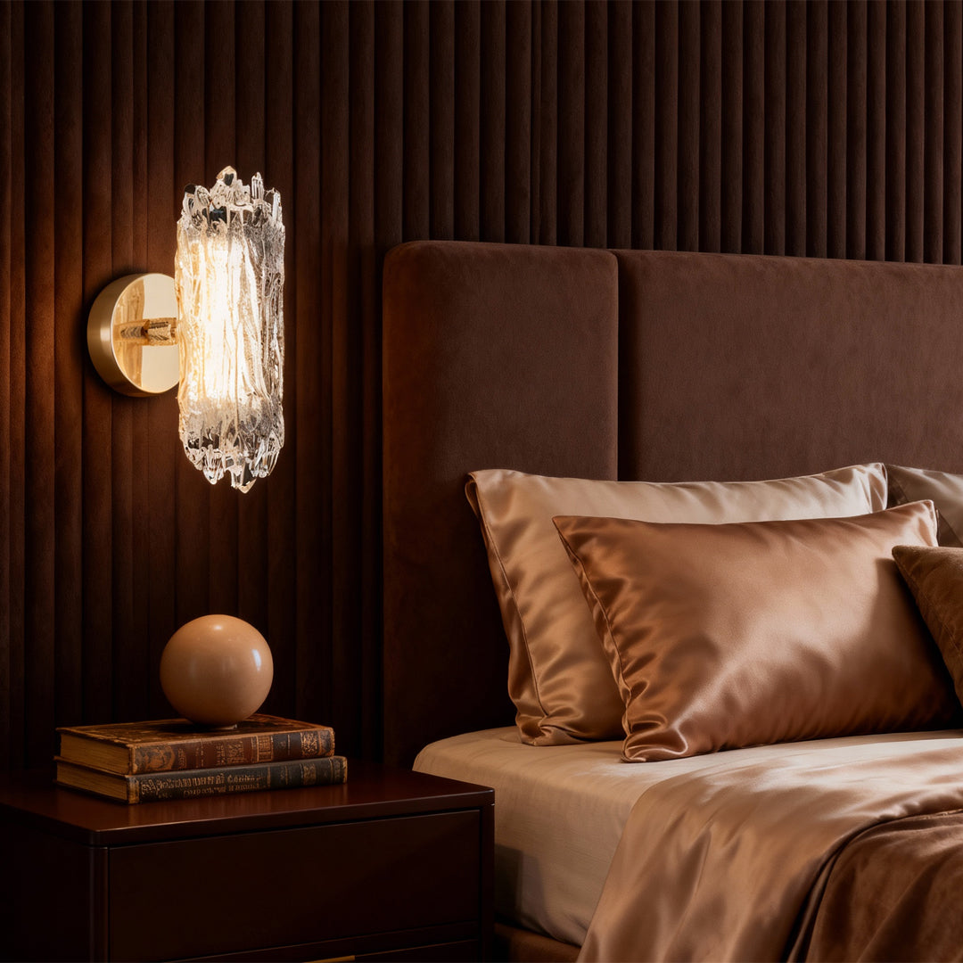 Modern wall lighting installed as bedroom accent creating ambient glow beside rich brown upholstered headboard