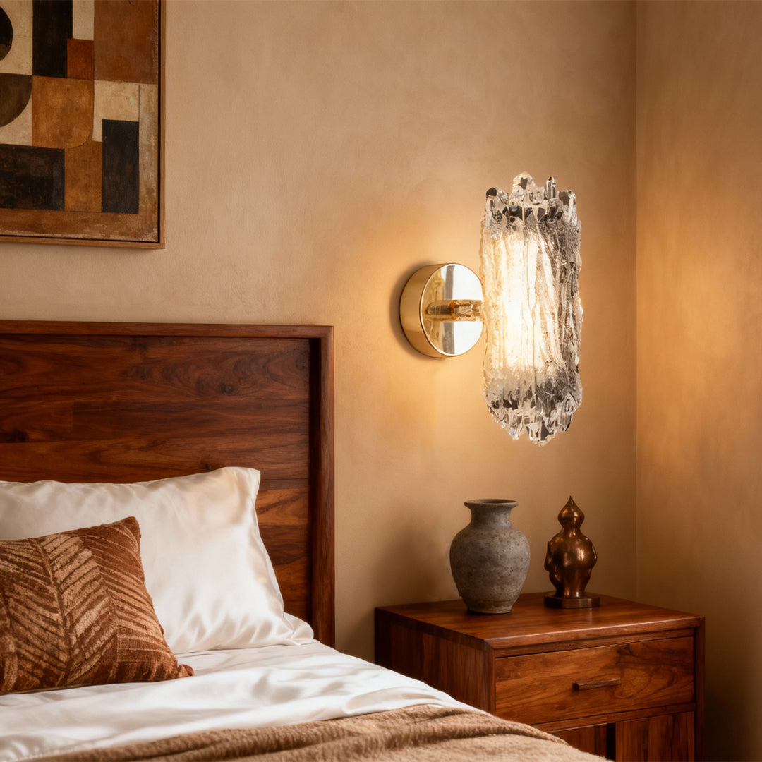 Modern wall lighting providing bedside illumination in warm-toned bedroom with wooden furniture and terracotta accents
