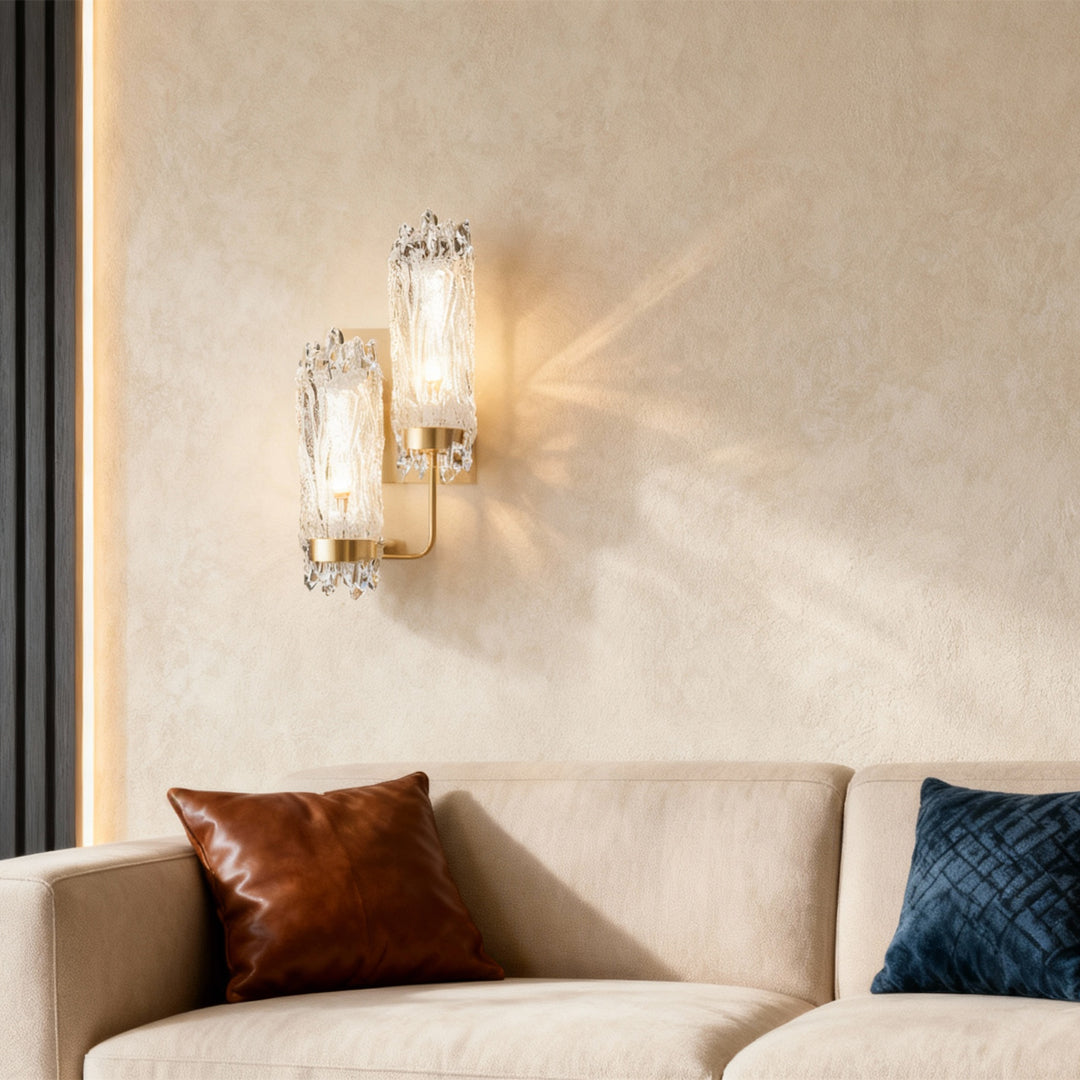Modern wall lighting creating cozy atmosphere beside bed with textured linens in elegant neutral interior