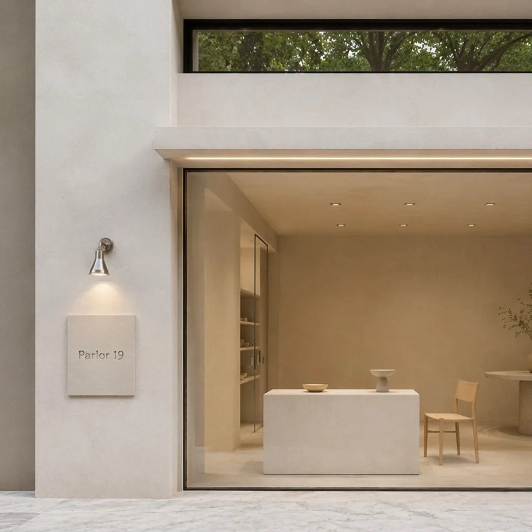 Modern wall sconces outdoor lighting mounted beside a contemporary home entrance.