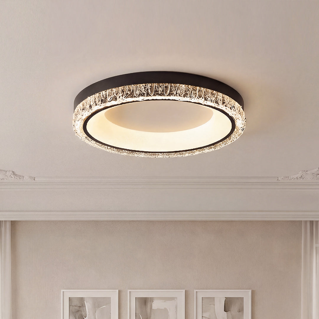 Modern white flush mount ceiling light with a black trim and sparkling crystal textured ring.