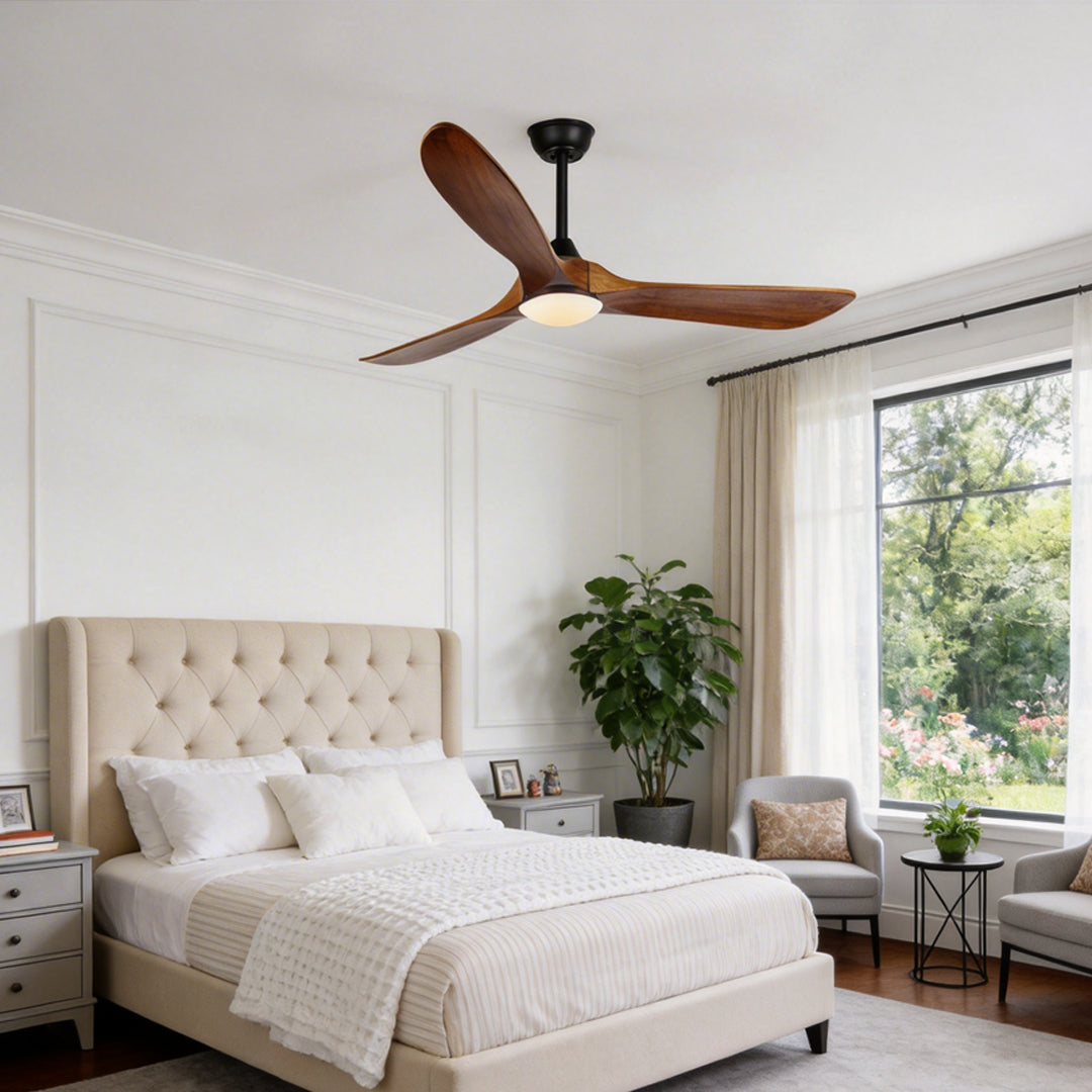 Modern wood ceiling fan with light providing ambient light in a stylish bedroom.