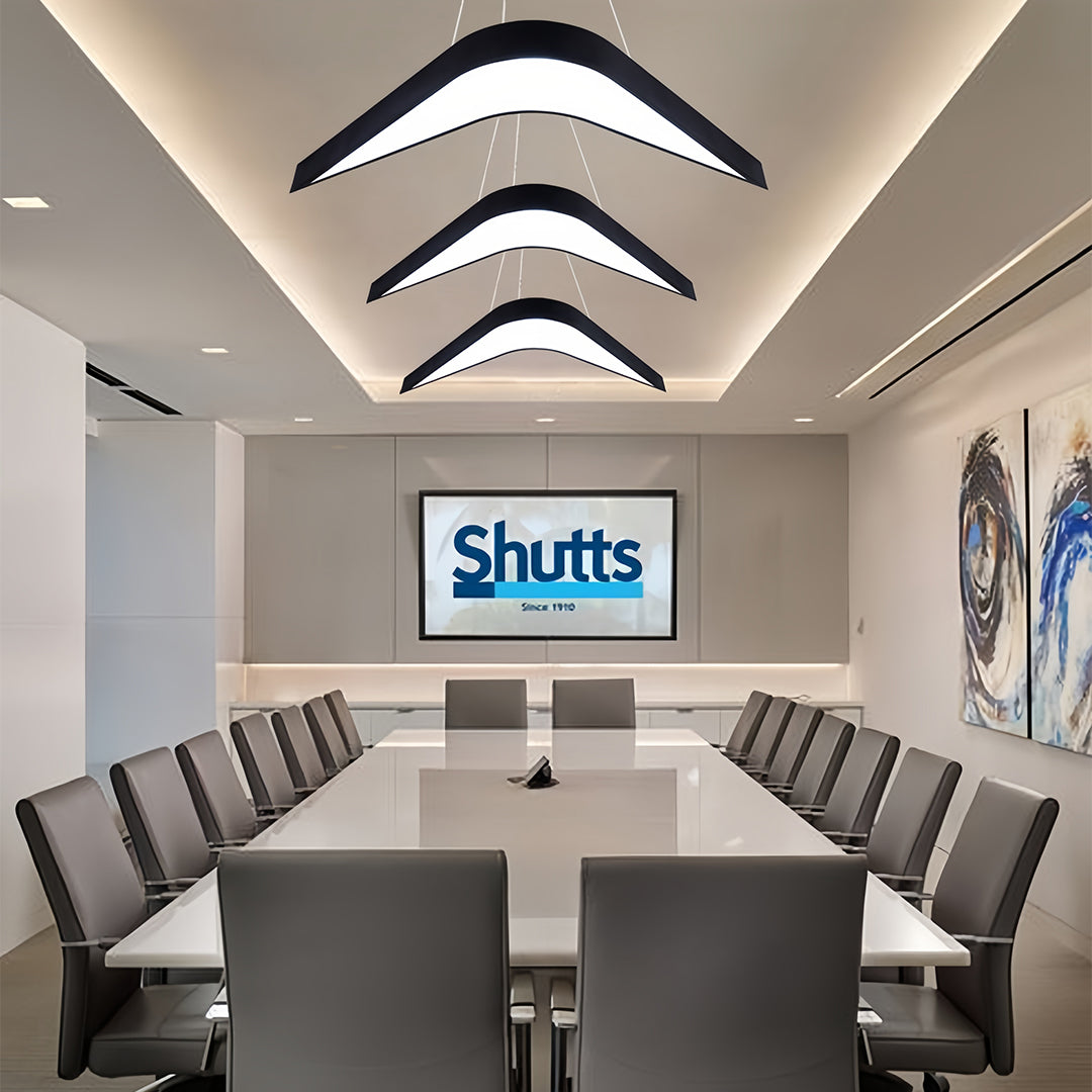 Modern wrought iron chandelier in a hallway, featuring sleek lines and a clean design for minimalistic lighting.