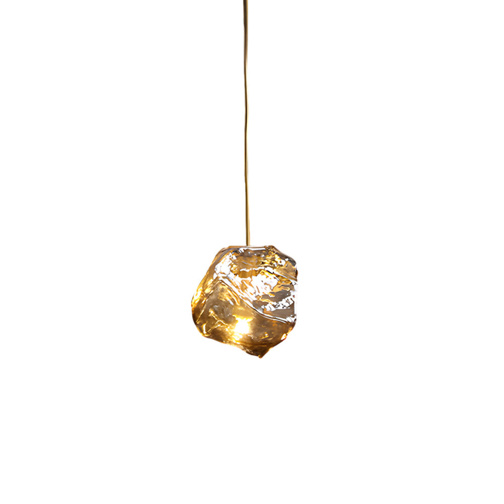 Molten rock pendant light in gold, side view of the organic design.