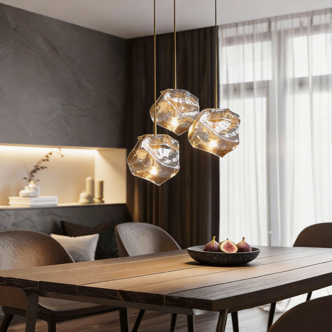 Molten rock pendant light providing soft illumination above a contemporary dining setup.