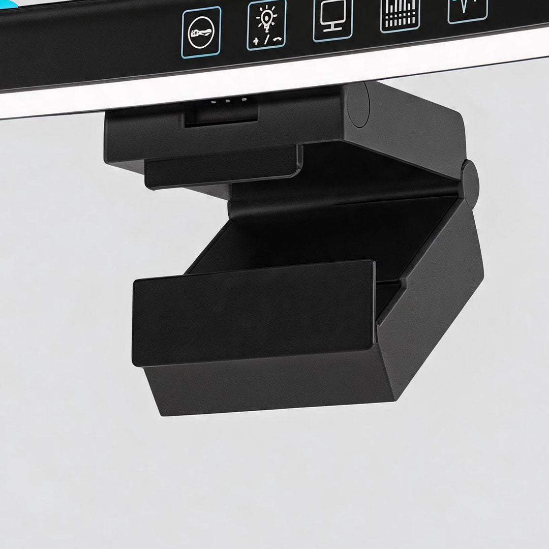 Close-up of the adjustable clip mount used to secure a monitor LED light bar to a computer screen.