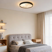 Moon ceiling light illuminating a modern bedroom with warm ambient glow.
