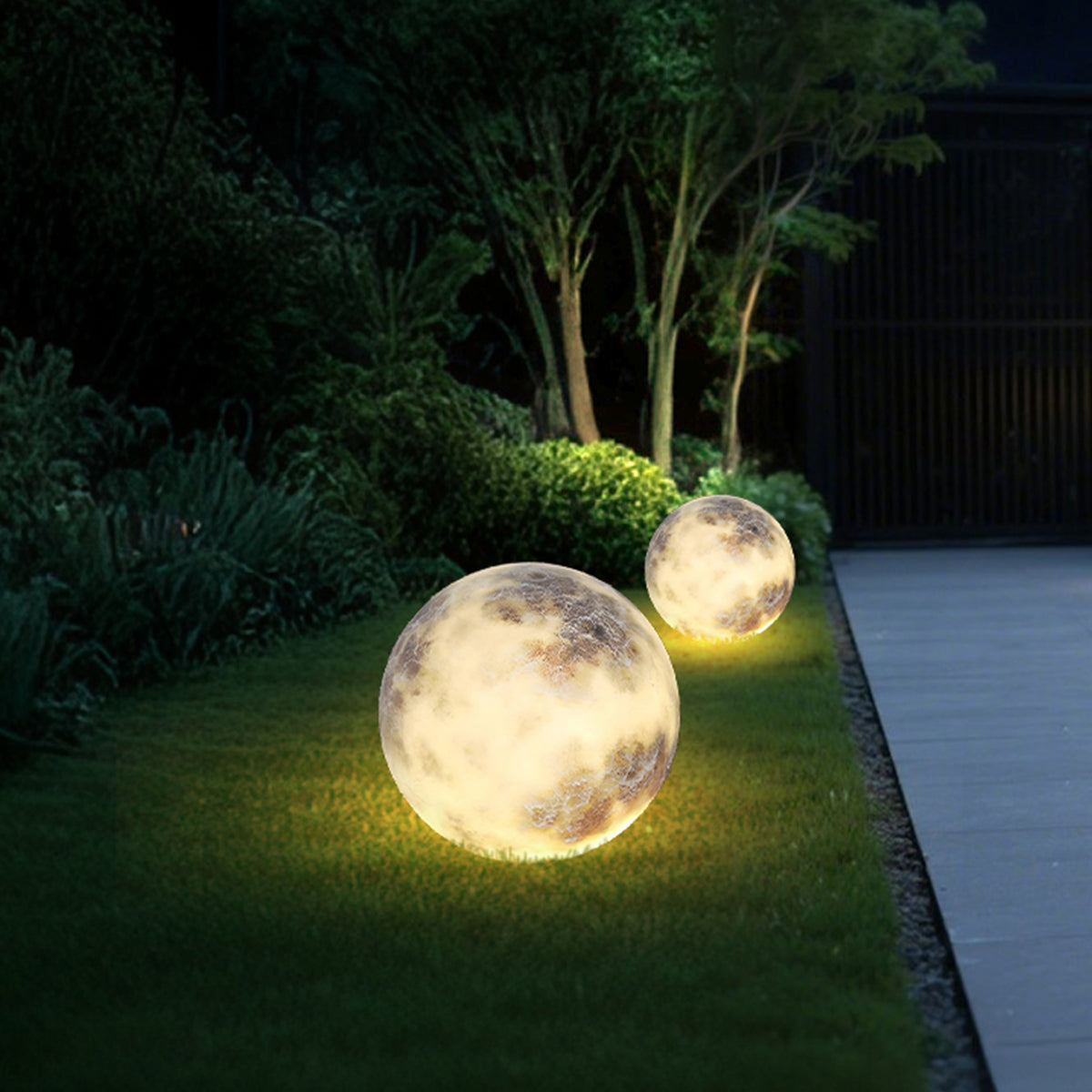 Moon light spheres used as accent lighting on a lawn