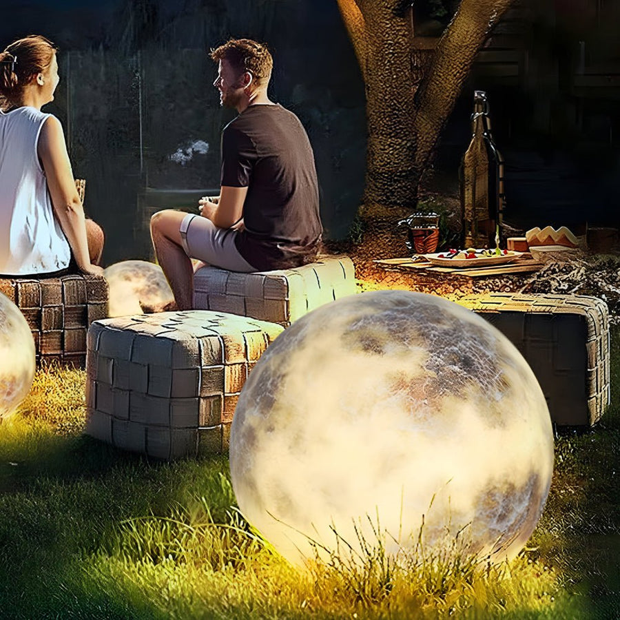 Moon light placed near an outdoor seating area at night