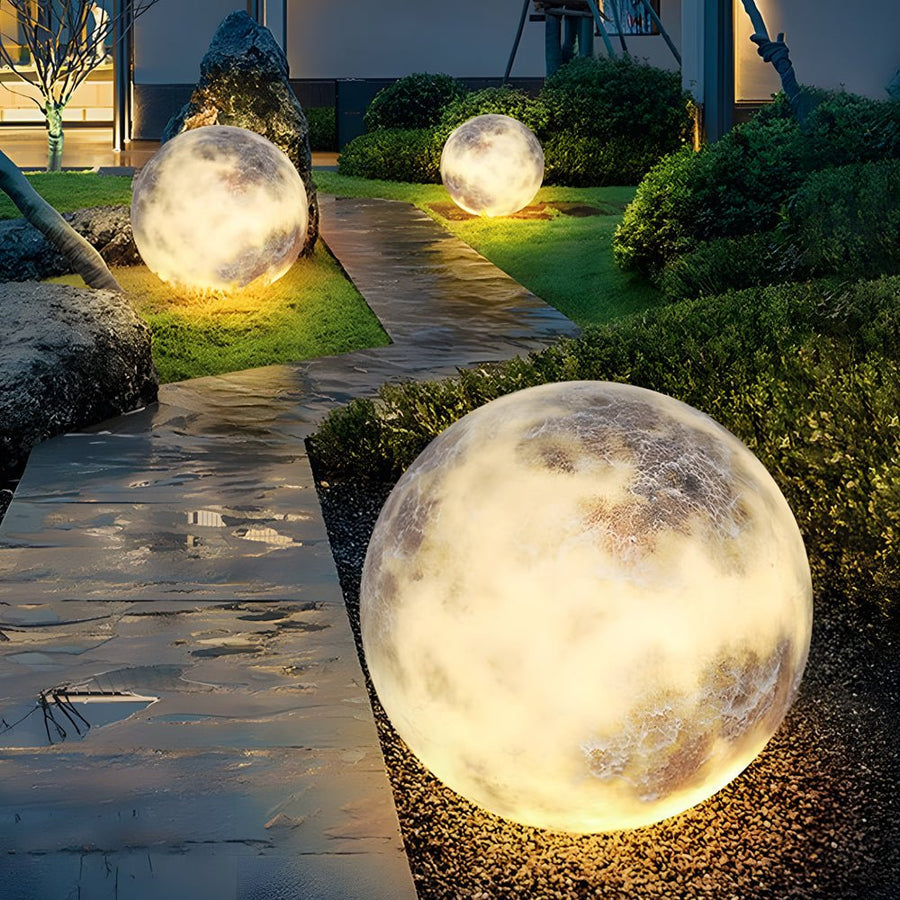 Moon light illuminating an outdoor garden pathway at night