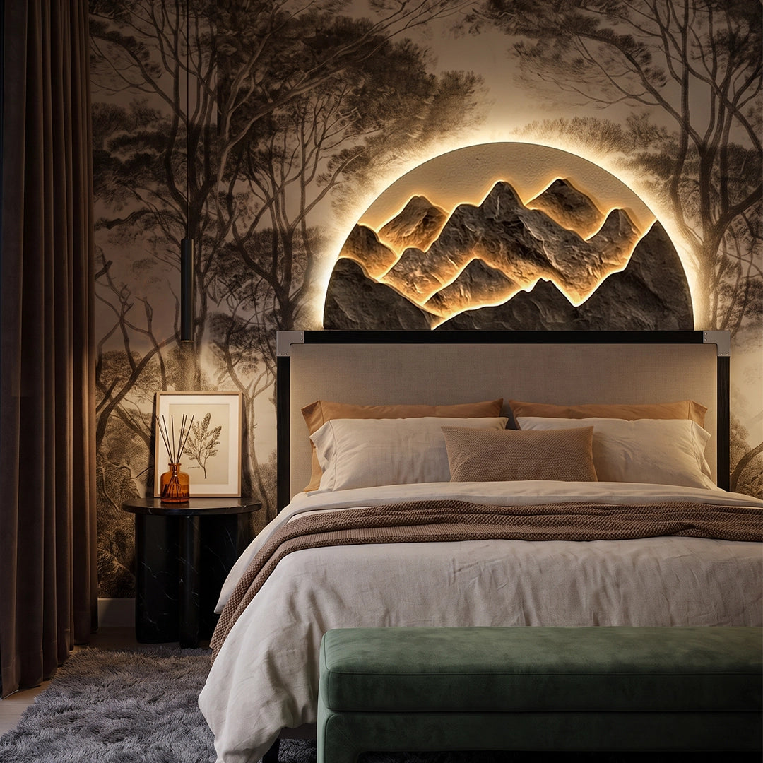 Mountain LED wall light installed above a bed, creating a warm focal point in a cozy bedroom.