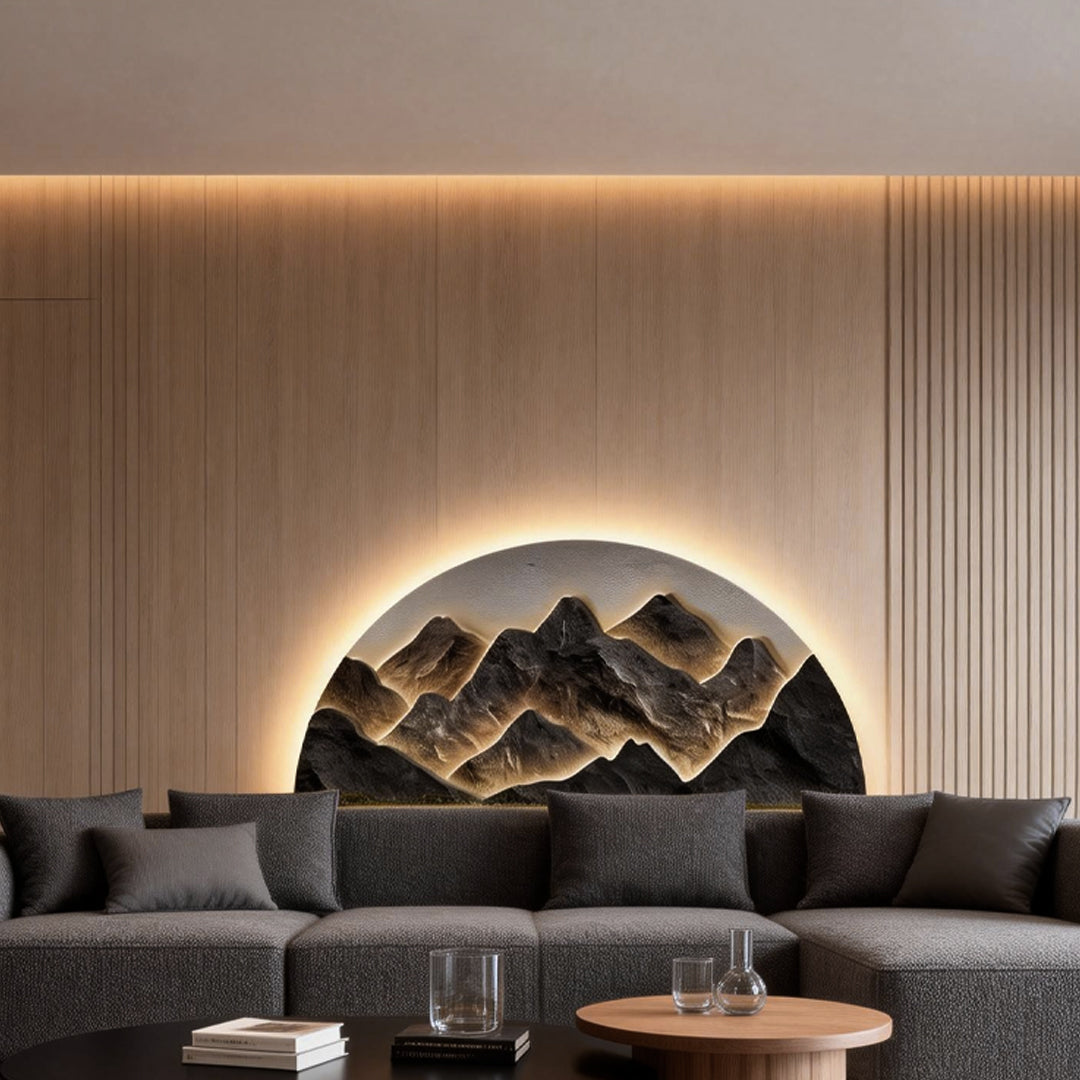 Mountain LED wall light illuminating a contemporary living room with a gray sofa and coffee table.