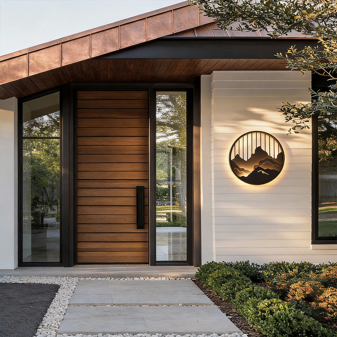 Mountain LED wall light installed on modern home exterior creating artistic landscape lighting.