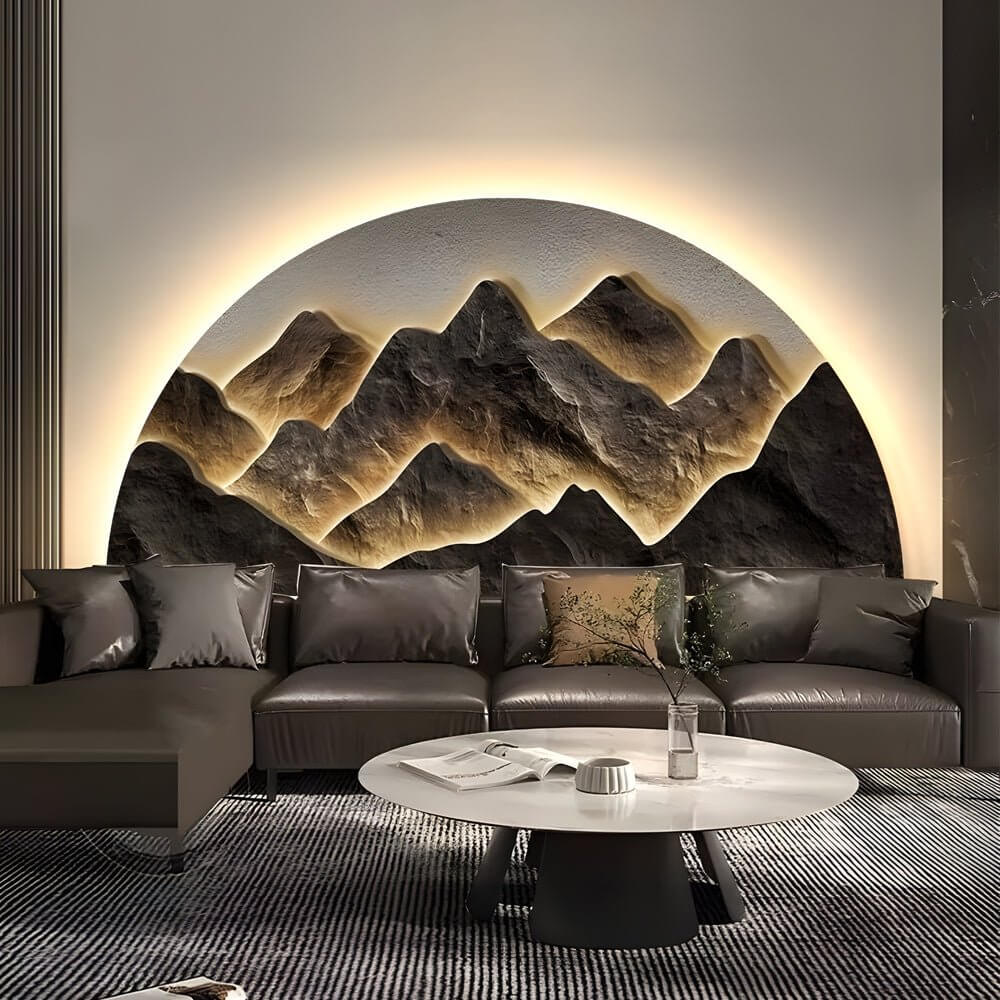 Mountain LED wall light enhancing a stylish living room with a white sofa and round table.