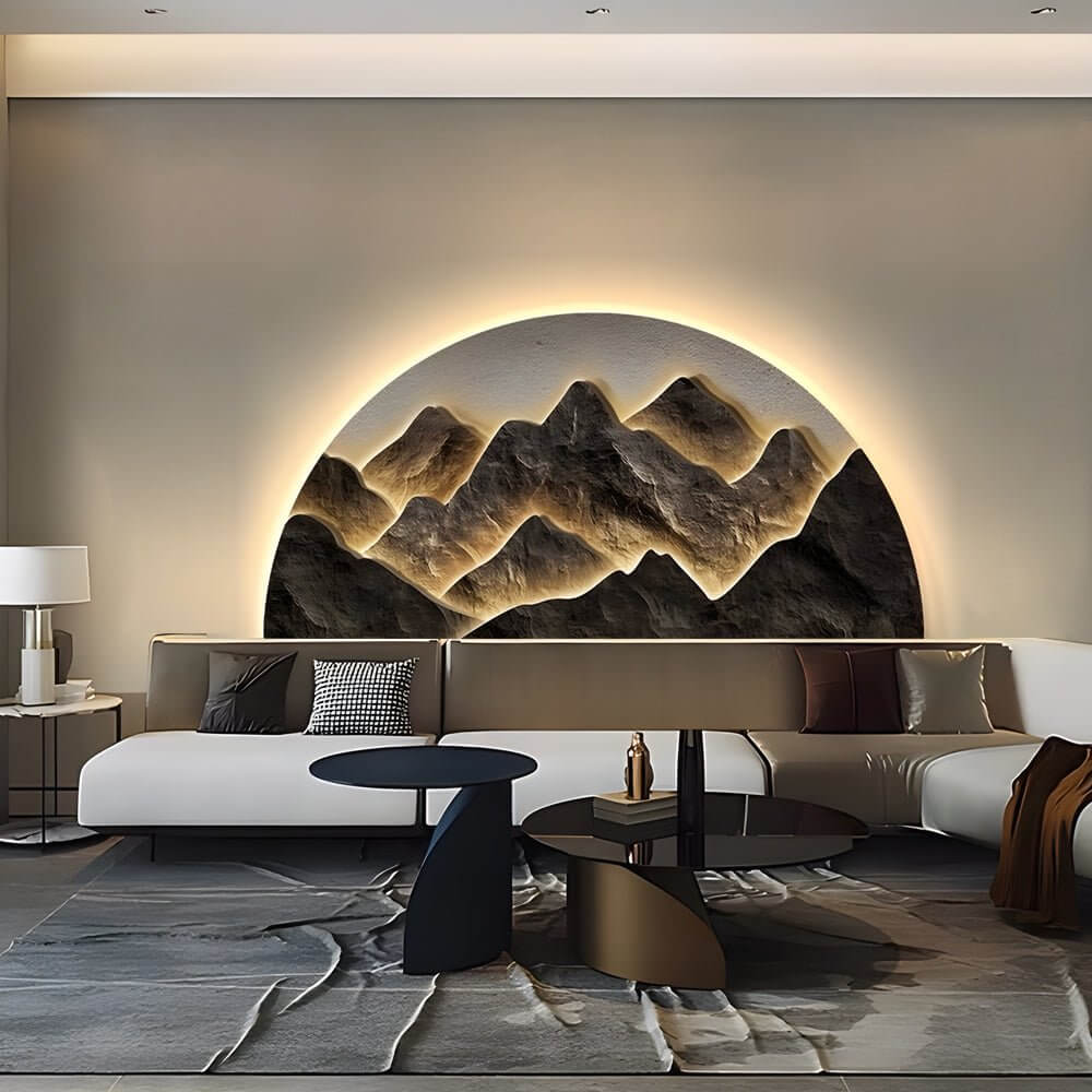 Mountain LED wall light providing warm illumination in a cozy bedroom with a gray bed.