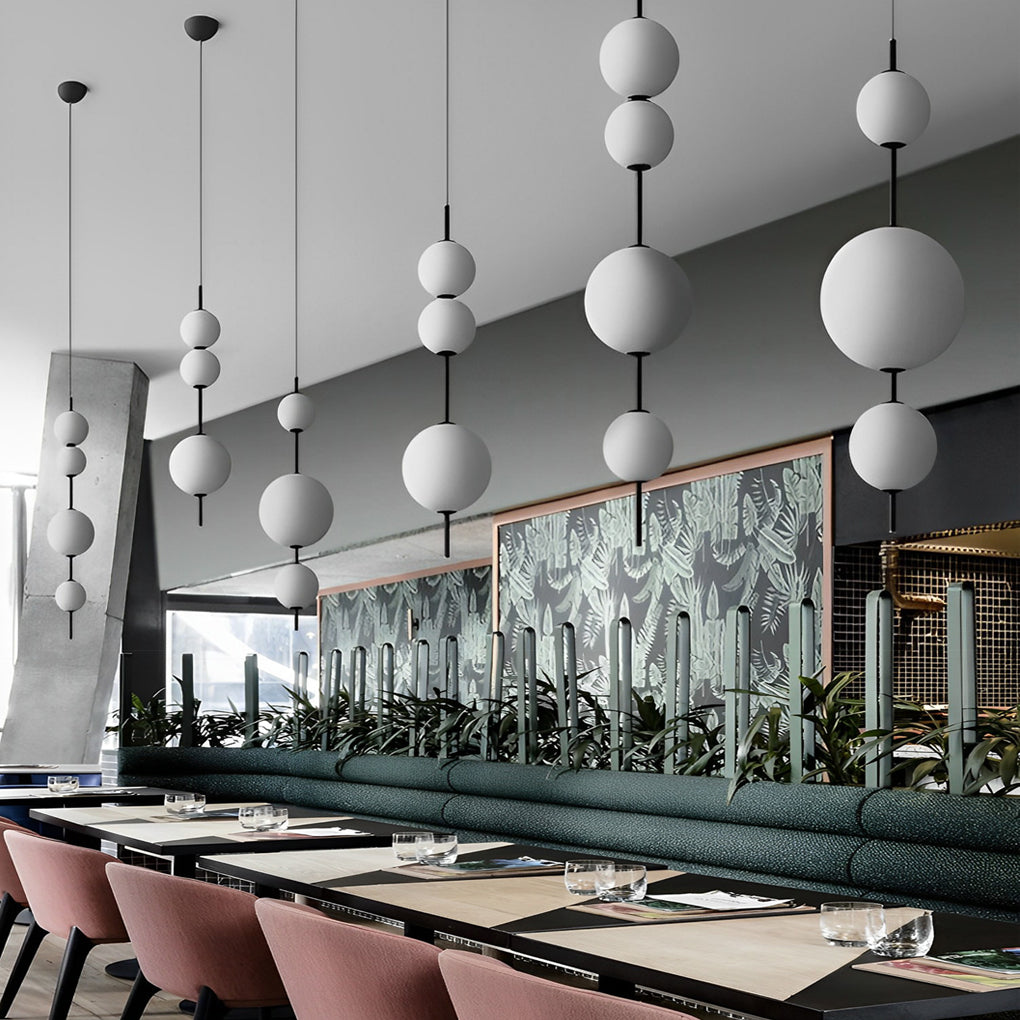 Multi ball pendant light with a black finish, enhancing a contemporary interior.