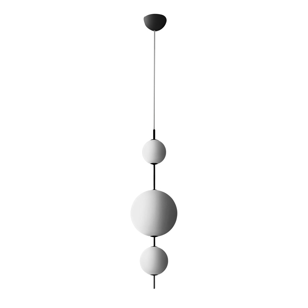 Multi ball pendant light with a black and white finish, enhancing a modern interior.