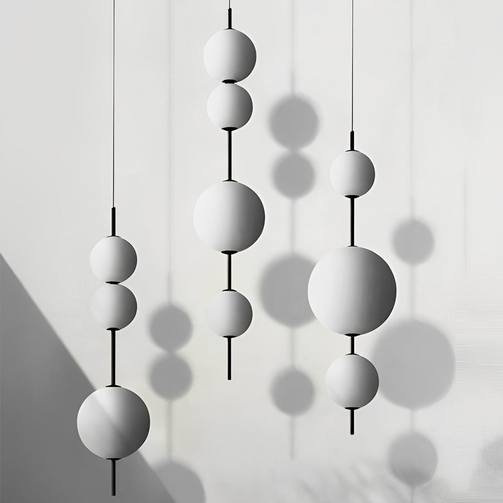 Multi ball pendant light with a detailed view of its spherical structure.