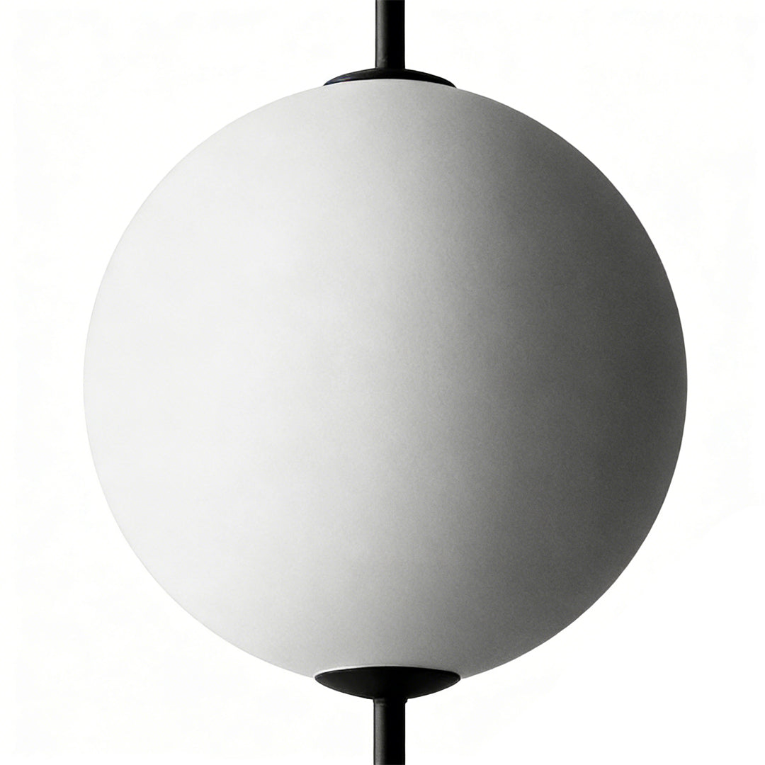 Multi ball pendant light providing elegant illumination in a stylish living room.