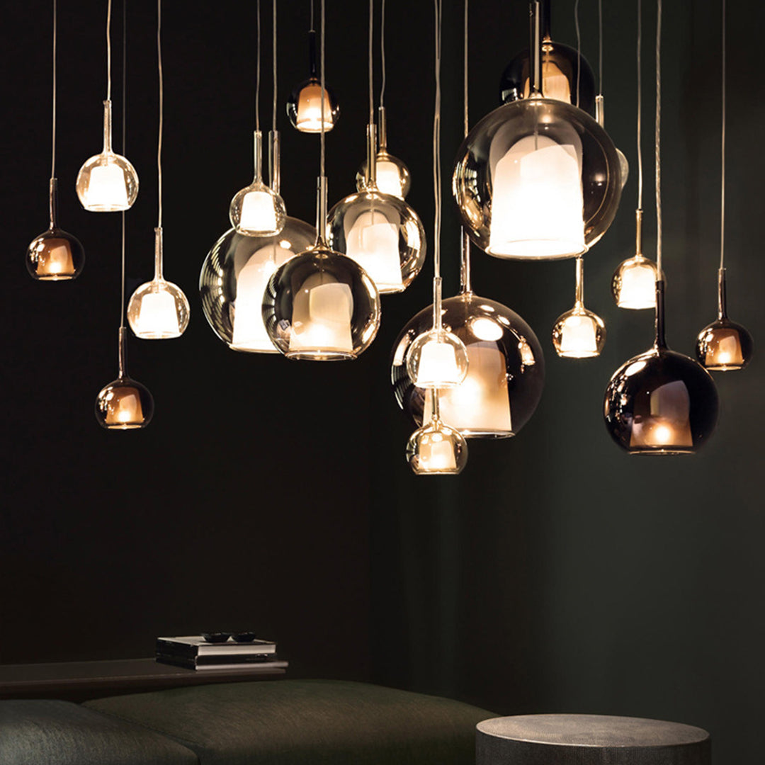 Elegant multi crystal chandelier with multiple glass ball pendant lights creating dramatic ambient lighting