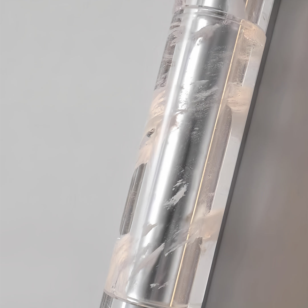 Designer crystal pendant light combining multiple vertical elements with crystal diffusers for enhanced ambient illumination