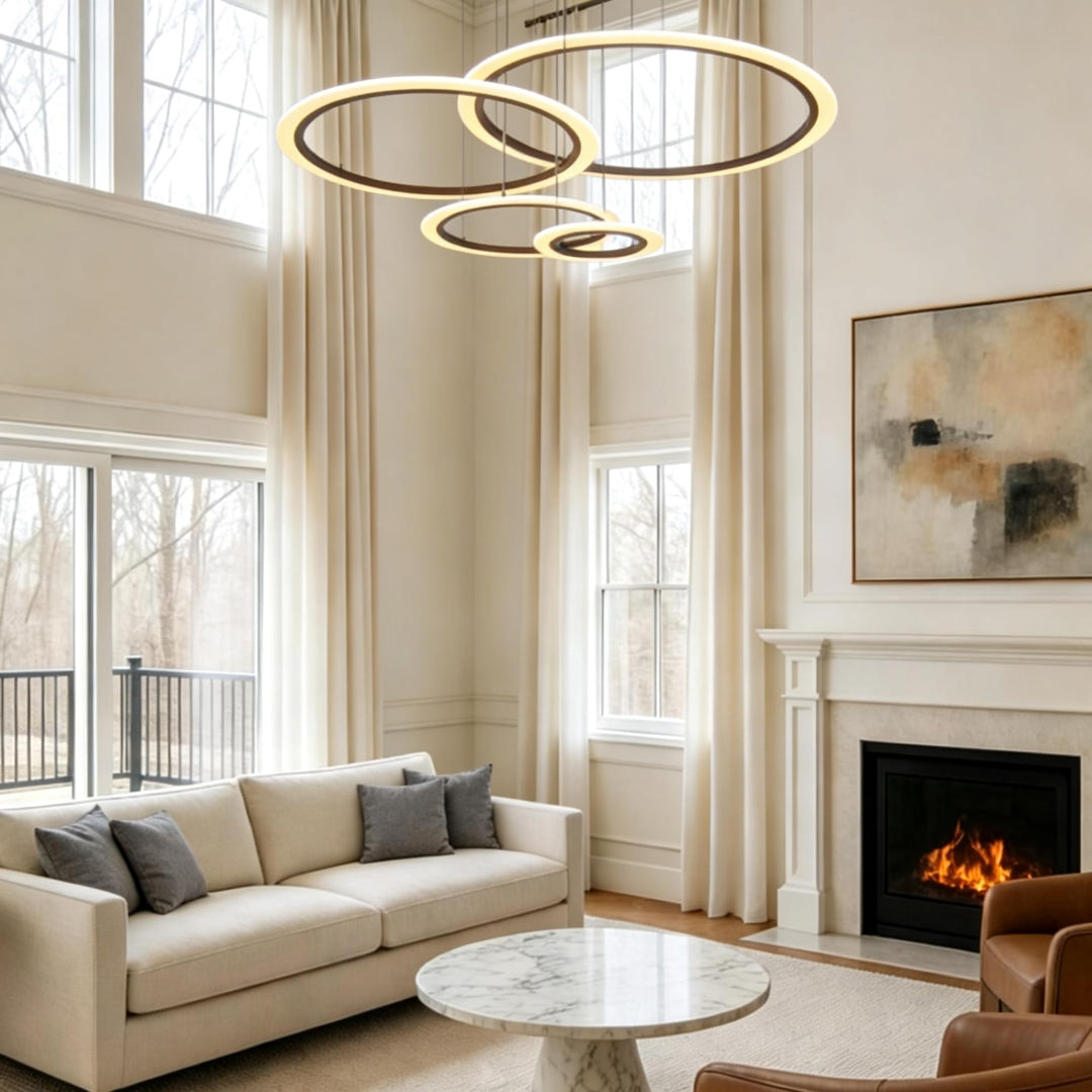 Multi ring LED chandelier hanging in a high ceiling modern interior.