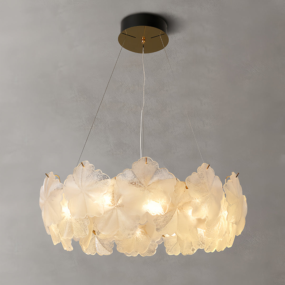 Multi-tiered glass garland chandelier lights creating stunning focal point with cascading illuminated petals