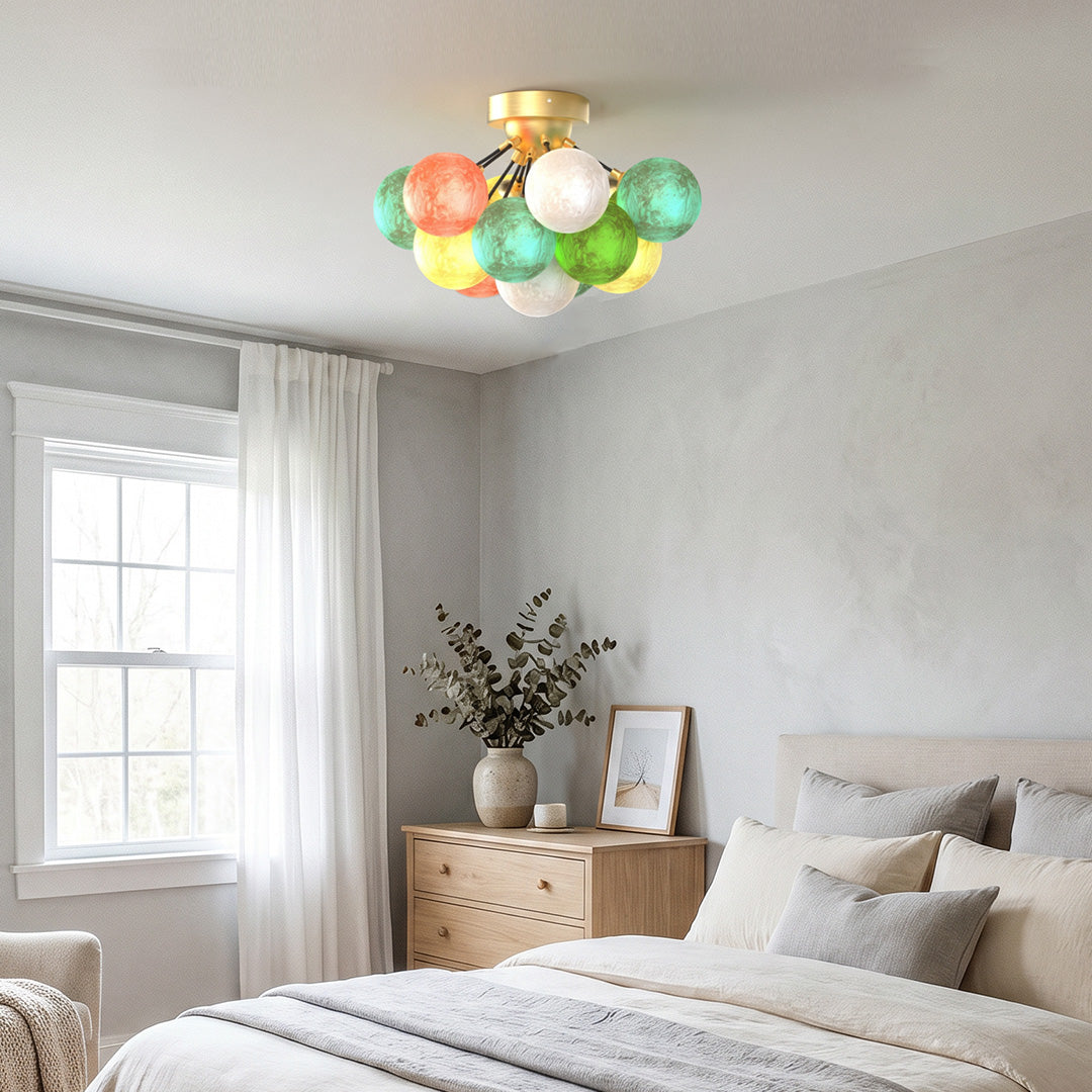 Multicolor glass ceiling light fixture installed in a bedroom, adding warm ambient lighting.
