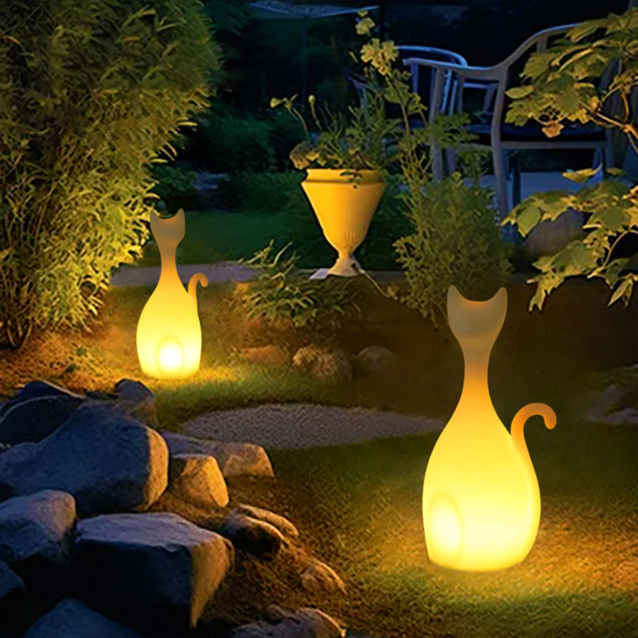 Multiple illuminated cat lights creating enchanting poolside lighting arrangement at evening