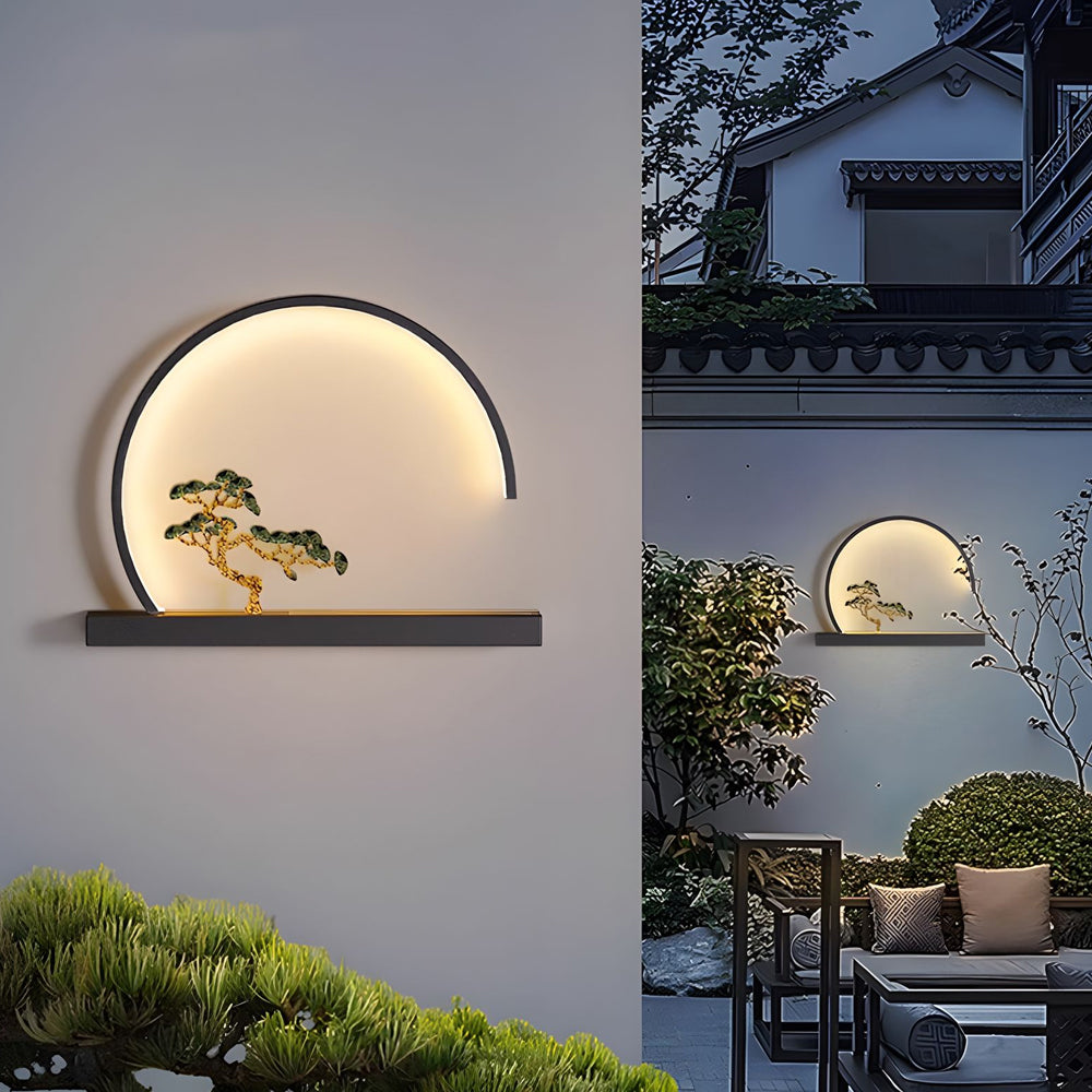 Multiple circular wall lights with bonsai tree motifs creating decorative lighting pattern on contemporary exterior wall