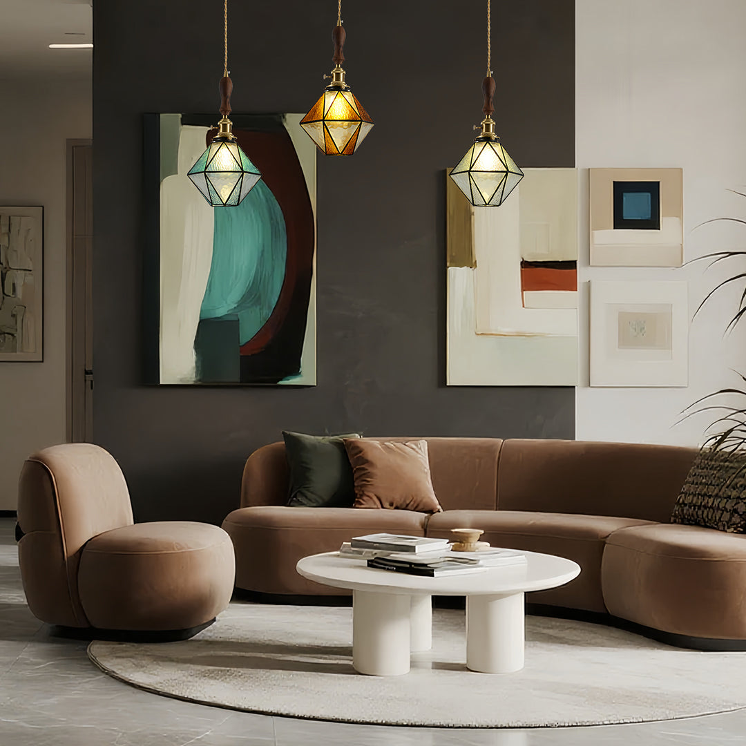 Multiple diamond-shaped pendant lights in sophisticated living room with dark walls and modern contemporary furniture