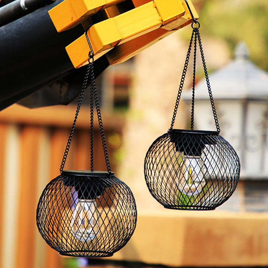 Multiple hanging lanterns creating warm ambient lighting on covered outdoor patio or terrace