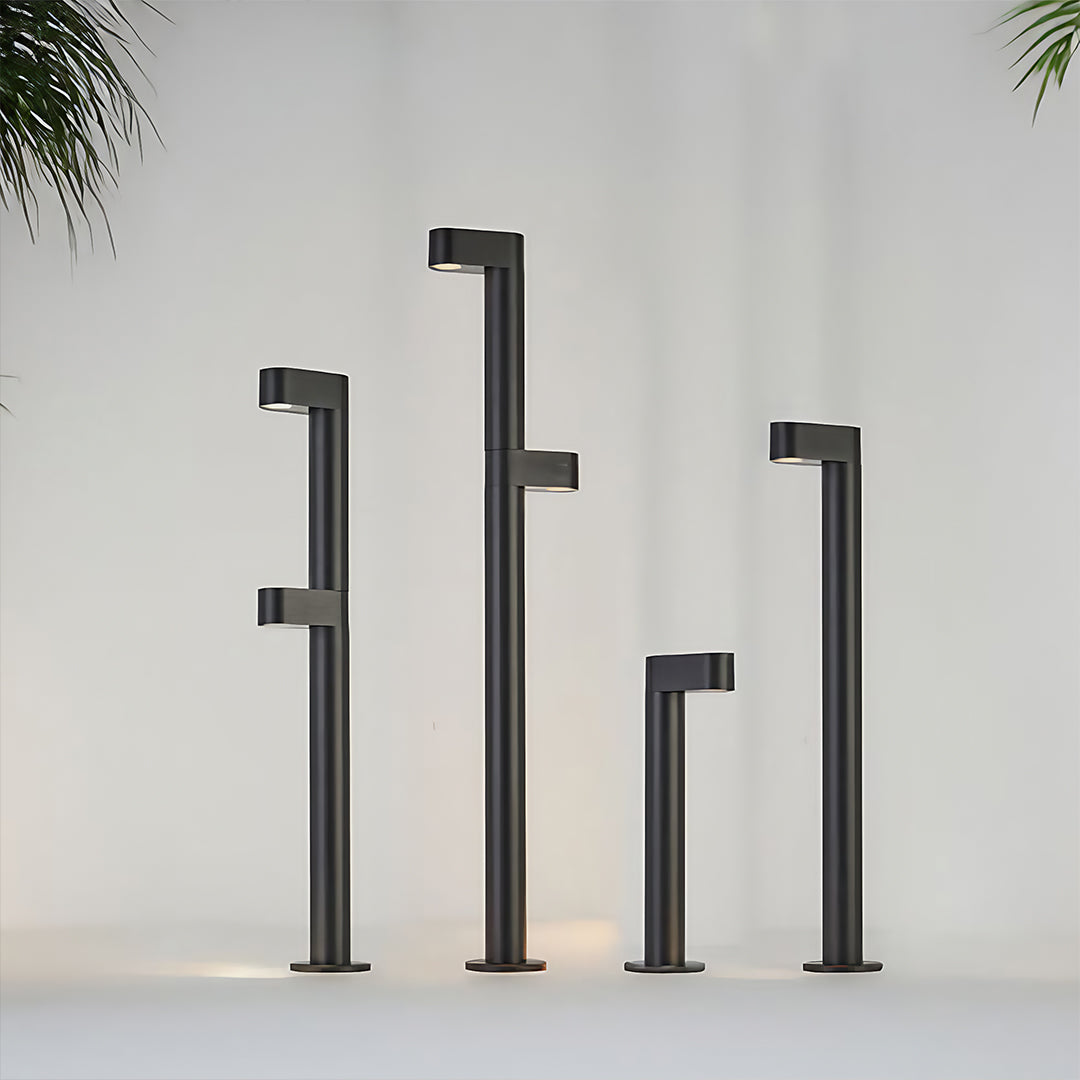 Collection of different height black LED path light bollards showing size variations for lighting design