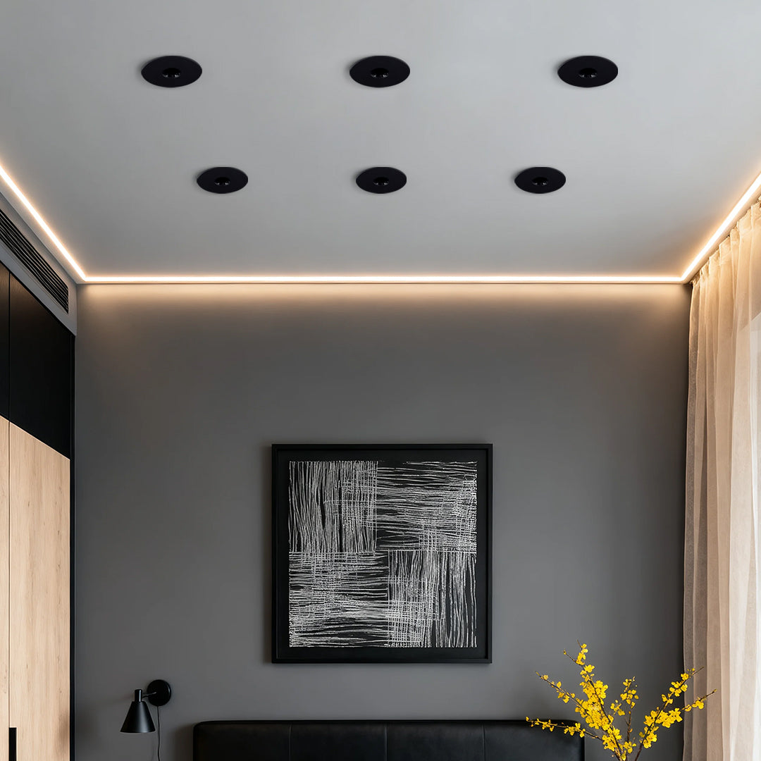 Multiple LED recessed spotlights creating ambient lighting in contemporary hallway with warm cove illumination