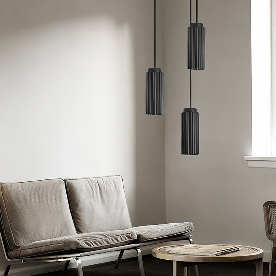 Multiple black metal pendants light in modern interior with minimalist decor
