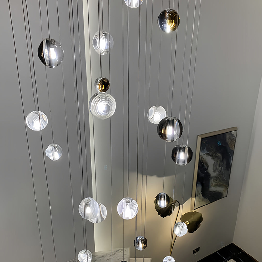 Multiple small black pendant lights mounted on pegboard wall showing contemporary industrial design