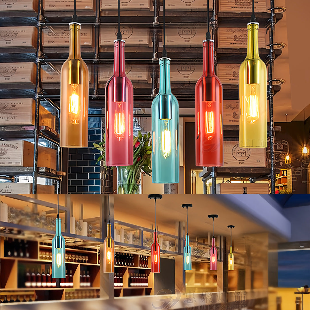 Multiple wine bottle pendant lights in vibrant colors suspended over commercial bar area with wood backdrop