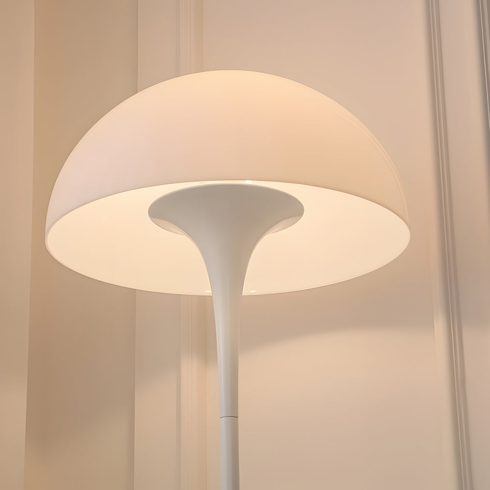 Mushroom floor lamp with a white shade, placed in a modern living room with natural light.