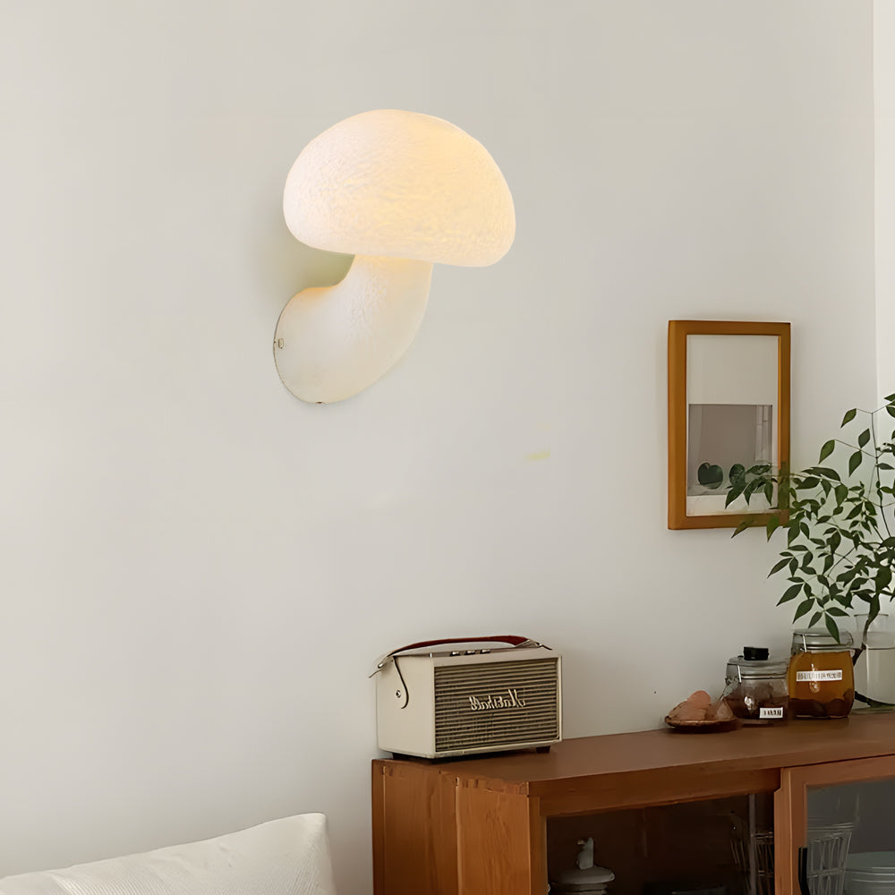 Modern mushroom-shaped LED wall lights creating warm ambient lighting in minimalist bedroom with wooden furniture and neutral decor