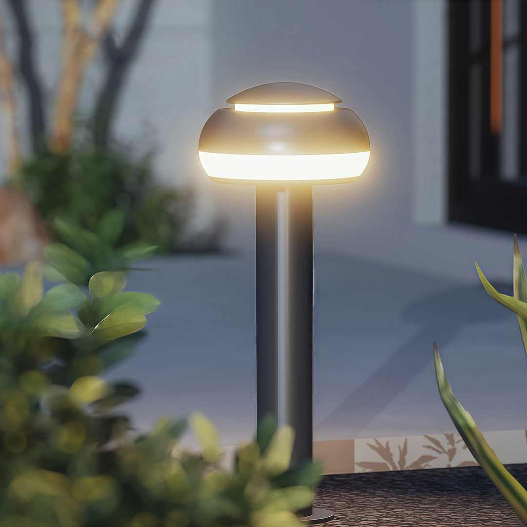 Mushroom path light placed along a patio, enhancing the outdoor ambiance with subtle lighting.