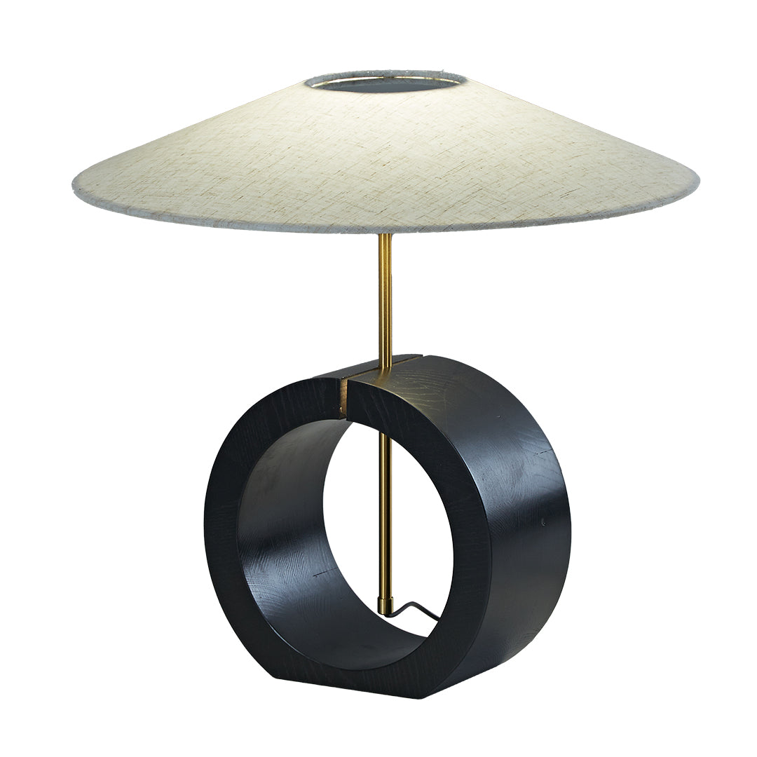 Contemporary table lamp with dark wood ring base and soft linen shade.