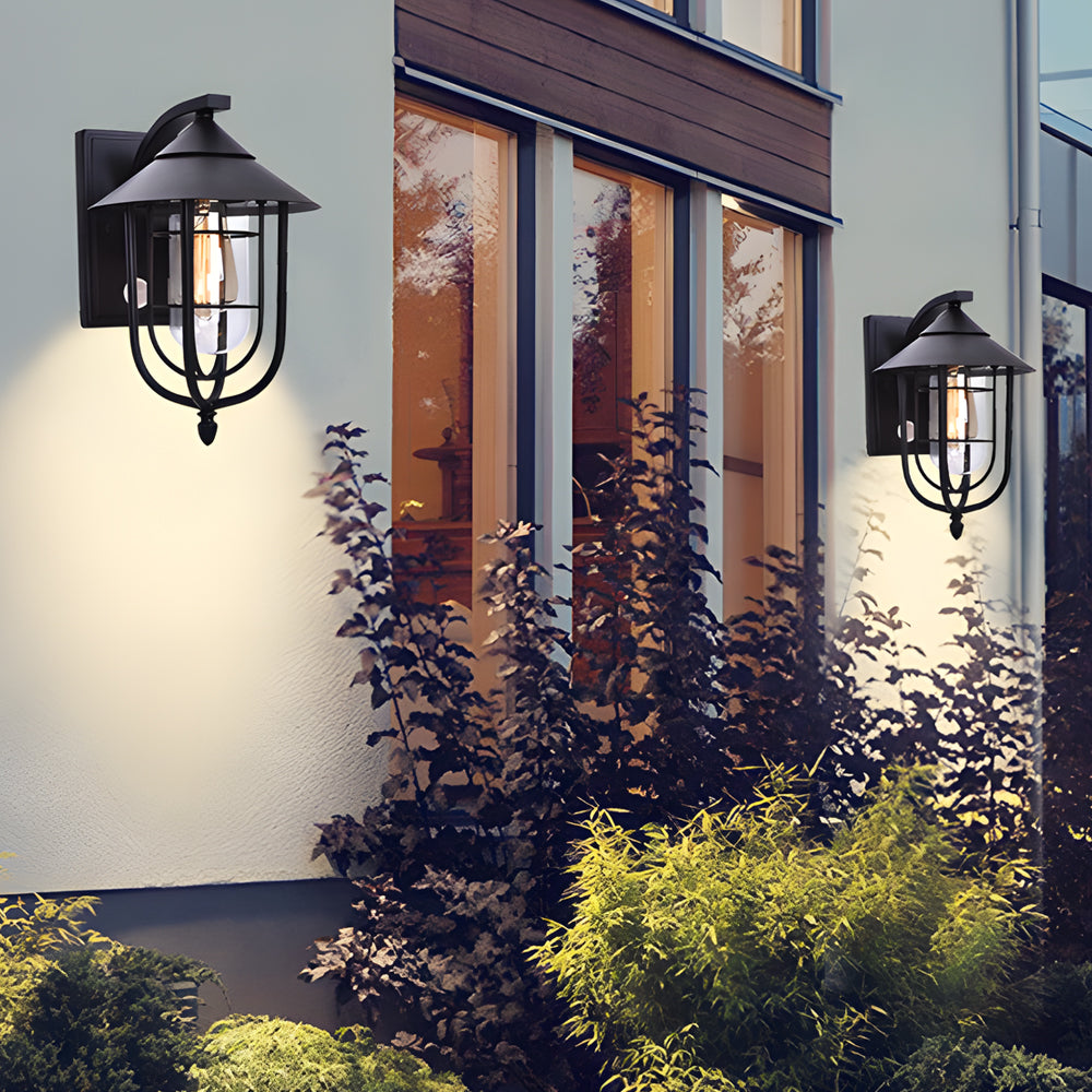 Pair of nautical wall sconces installed beside a window, adding classic coastal charm to an outdoor facade.