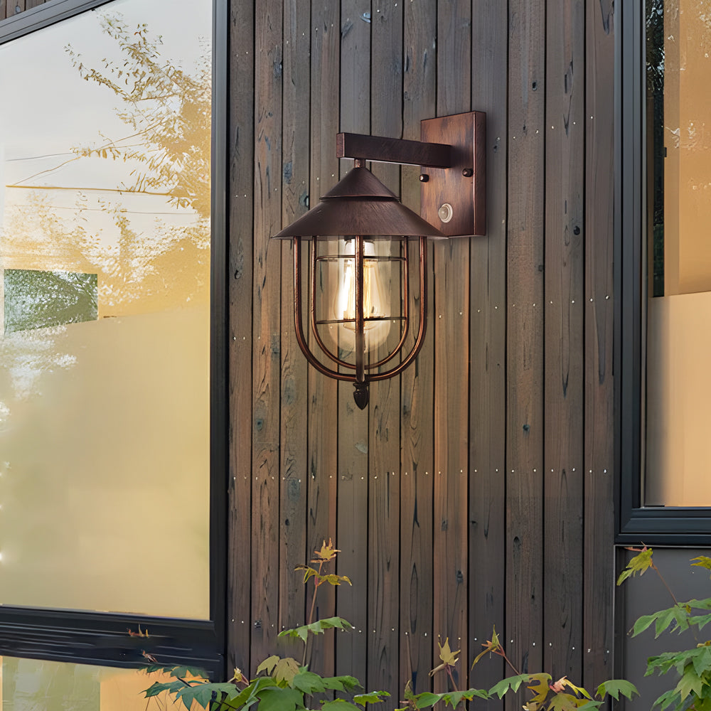 Nautical wall sconce mounted on wooden siding, blending rustic textures with maritime-inspired lighting.