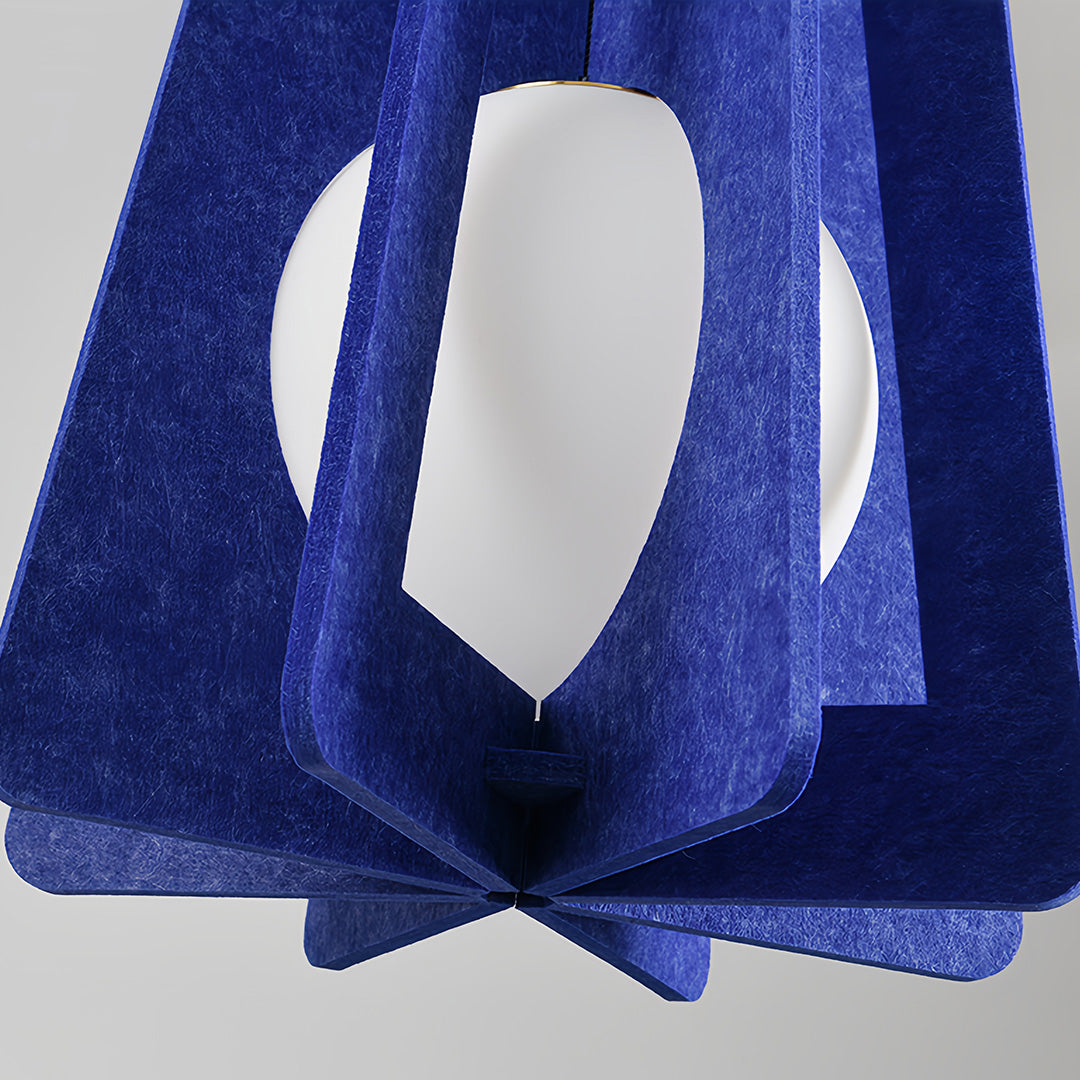 Close-up of a decorative navy blue felt fun pendant lights shade with a unique geometric cut-out design and soft texture. 
