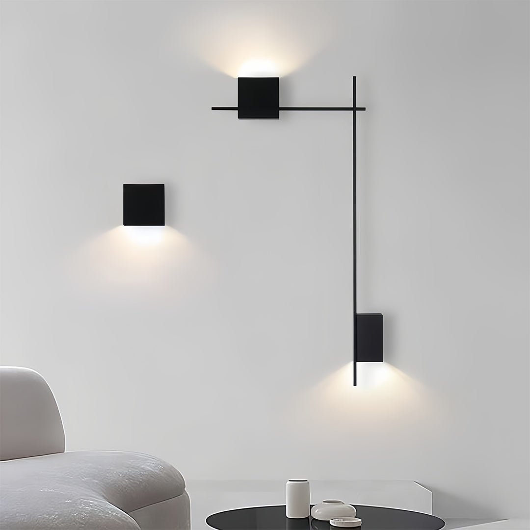 Artistic decor wall lights providing accent lighting in neutral modern interior with geometric forms