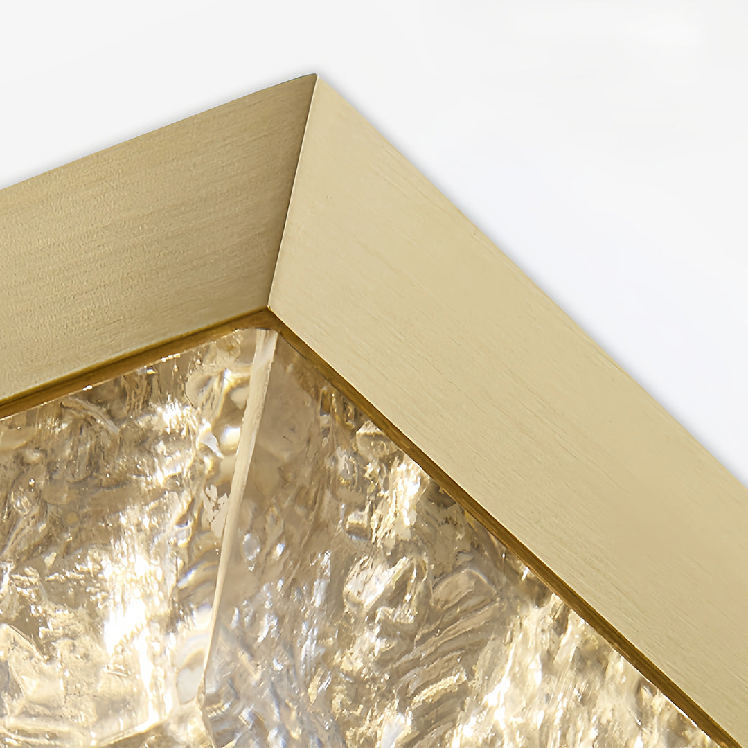 Angled view of large gold pendant light displaying dimensional profile and crystalline interior detail.