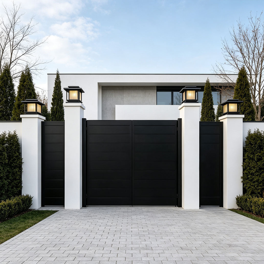 Nighttime outdoor entrance illuminated by driveway pillar solar lights with elegant warm glow.